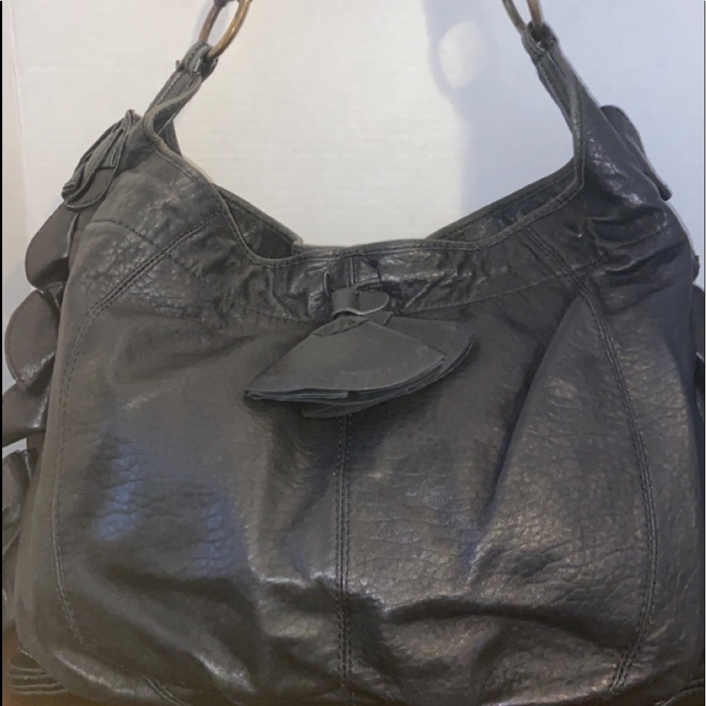 Vince Camuto black handbag with rose detail on sides
